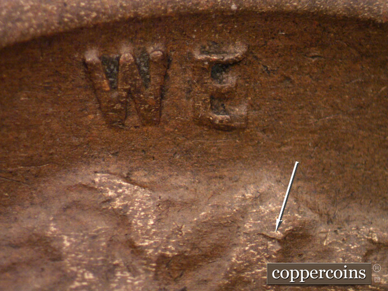 Die-stage B marker on 1919S•1DO•001 showing Possible die chip in hair.