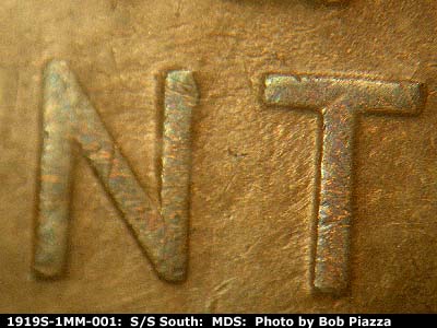Die-stage B marker on 1919S•1MM•001 showing Die gouge between NT of CENT.