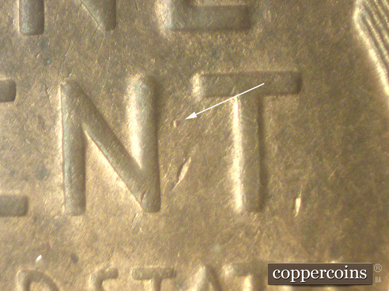 Die-stage C marker on 1919S•1MM•001 showing Die gouge between NT of CENT.