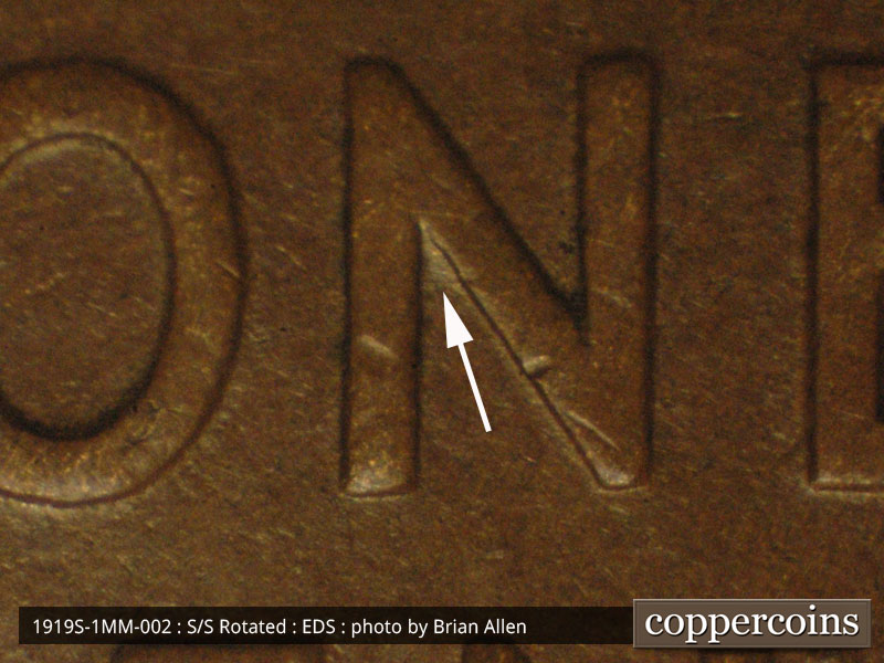 Die-stage A marker on 1919S•1MM•002 showing Small die gouge inside the upper N of ONE.