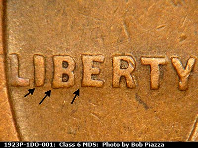 Die-stage B marker on 1923P•1DO•001 showing Extra thickness on LIBERTY.