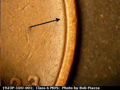 Die-stage B marker on 1923P•1DO•001 showing A small die gouge near the rim to the northeast of the 3 in the date.
