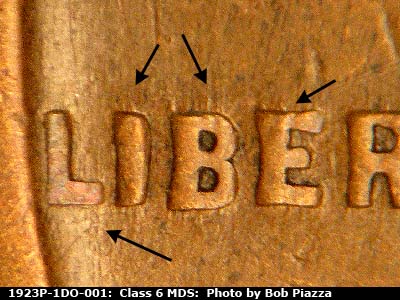 Die-stage B marker on 1923P•1DO•001 showing N/S die scratches through LIBE of LIBERTY.