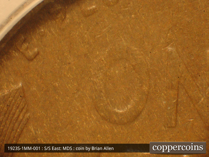 Die-stage B marker on 1923S•1MM•001 showing Metal pulling noted on E.PLU and filled die O of ONE was noted on this example. High grade examples would be benefici….