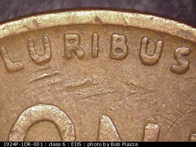 Die-stage A marker on 1924P•1DR•001 showing An obvious spread is seen on E PLURIBUS UNUM as well as both dots.