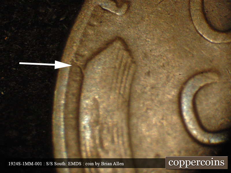 Die-stage A marker on 1924S•1MM•001 showing A die crack from the rim to the left wheat stalk.
