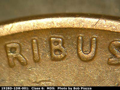Die-stage B marker on 1928D•1DR•001 (1928 Doubled Die Reverse).
