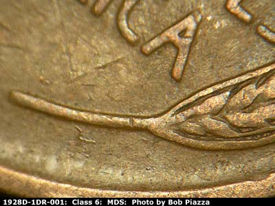 Die-stage B marker on 1928D•1DR•001 (1928 Doubled Die Reverse).