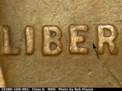 Die-stage B marker on 1928D•1DR•001 (1928 Doubled Die Reverse).