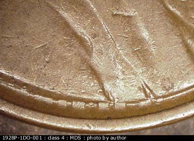 Die-stage B marker on 1928P•1DO•001 (1928 Doubled Die Obverse).