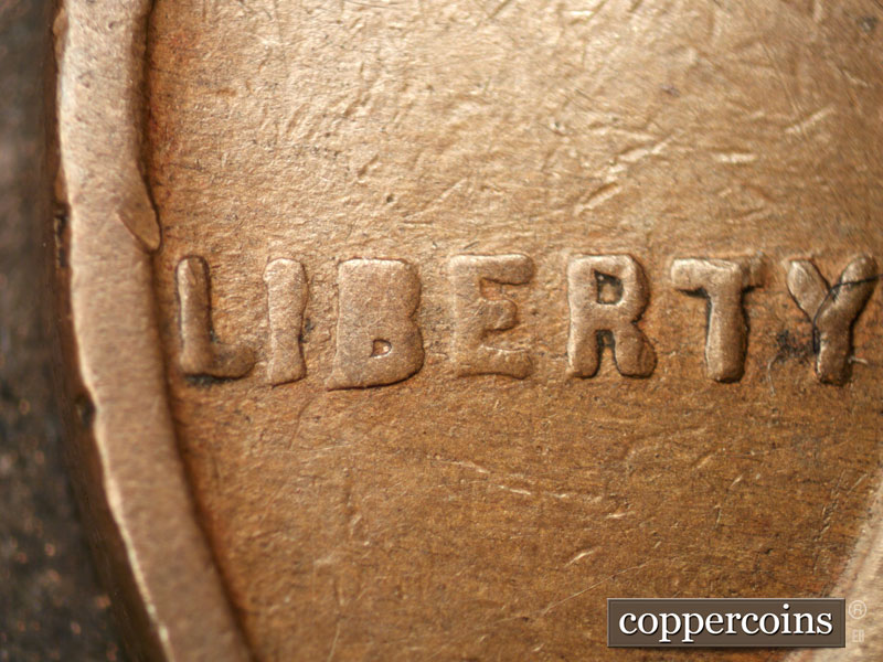 Die-stage B marker on 1928P•1DO•002 (1928 Doubled Die Obverse).