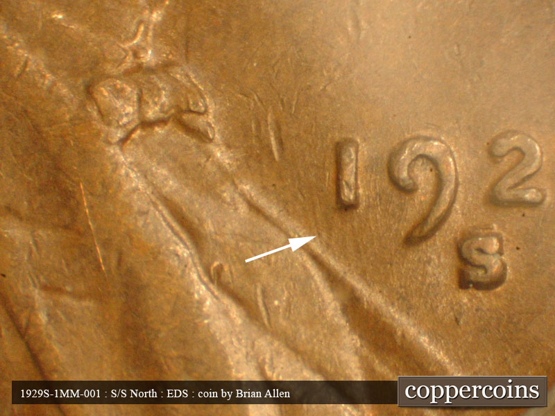 Die-stage A marker on 1929S•1MM•001 showing Worn NNW die scratch from lapel near 1 in date.