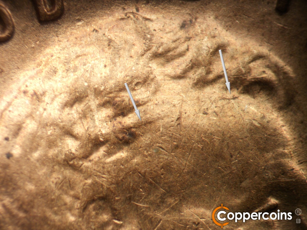 Die-stage B marker on 1929S•1MM•001 showing Die crack starting to form from hair through forehead.