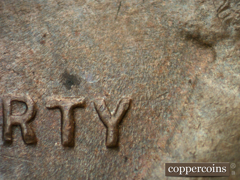 Die-stage B marker on 1934D•1MM•003 (1934 Repunched Mint Mark).