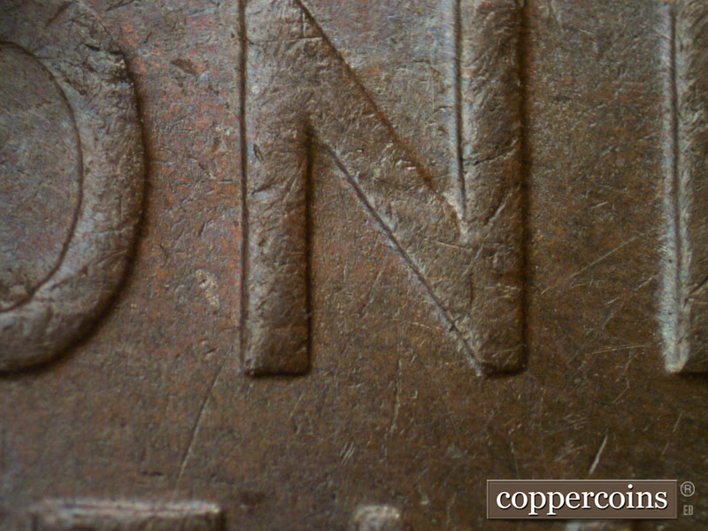 Die-stage B marker on 1934D•1MM•003 (1934 Repunched Mint Mark).