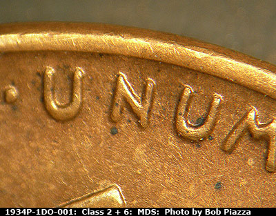Die-stage B marker on 1934P•1DO•001 (1934 Doubled Die Obverse).