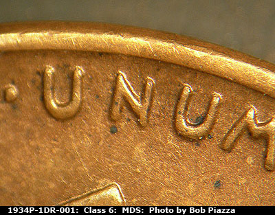 Die-stage B marker on 1934P•1DR•001 (1934 Doubled Die Reverse).