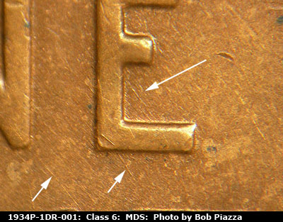 Die-stage B marker on 1934P•1DR•001 (1934 Doubled Die Reverse).