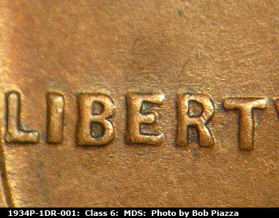 Die-stage B marker on 1934P•1DR•001 (1934 Doubled Die Reverse).