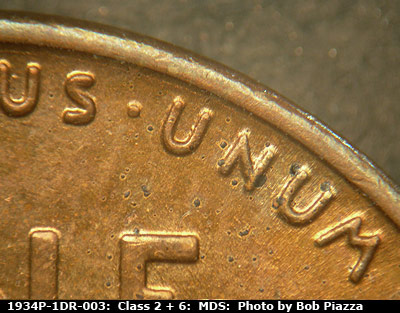 Die-stage B marker on 1934P•1DR•003 (1934 Doubled Die Reverse).