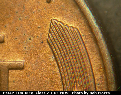 Die-stage B marker on 1934P•1DR•003 (1934 Doubled Die Reverse).