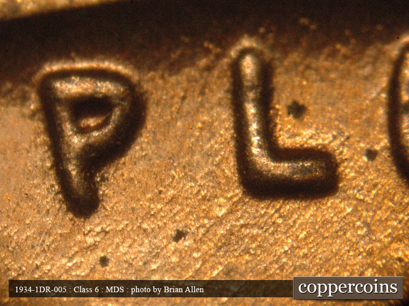 Die-stage B marker on 1934P•1DR•005 (1934 Doubled Die Reverse).