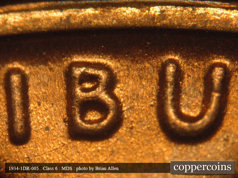 Die-stage B marker on 1934P•1DR•005 (1934 Doubled Die Reverse).