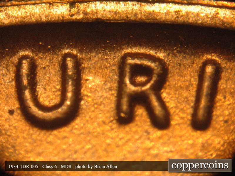 Die-stage B marker on 1934P•1DR•005 (1934 Doubled Die Reverse).