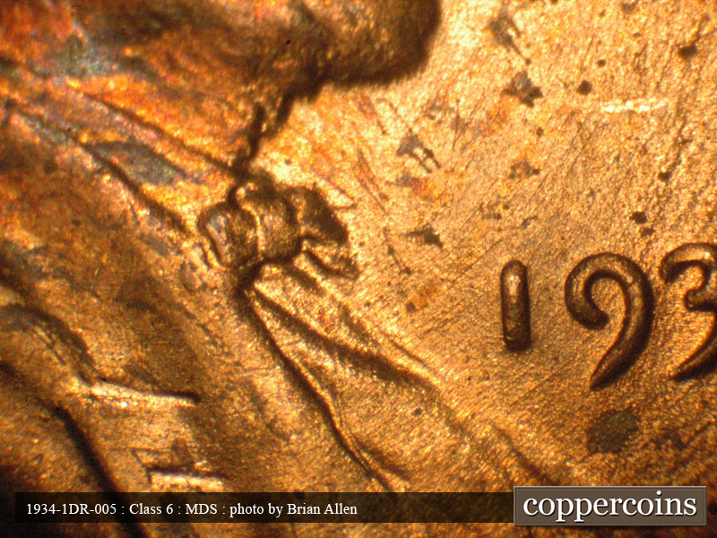Die-stage B marker on 1934P•1DR•005 (1934 Doubled Die Reverse).