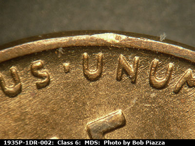 Die-stage B marker on 1935P•1DR•002 (1935 Doubled Die Reverse).