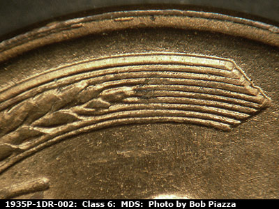 Die-stage B marker on 1935P•1DR•002 (1935 Doubled Die Reverse).