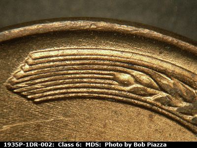 Die-stage B marker on 1935P•1DR•002 (1935 Doubled Die Reverse).