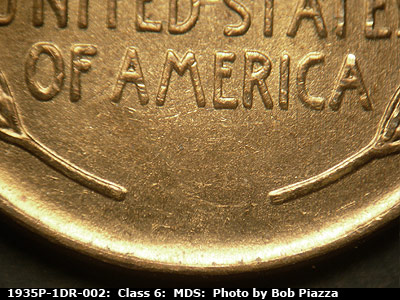 Die-stage B marker on 1935P•1DR•002 (1935 Doubled Die Reverse).