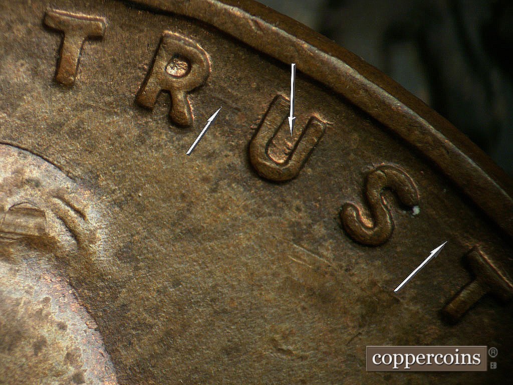 Die-stage B marker on 1937D•1DO•005 showing SE die scratches connect R to U in TRUST. Small die gouge in U of TRUST. SE die scratchconnect ST in TRUST.