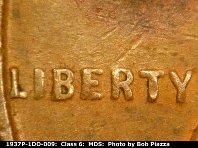 Die-stage B marker on 1937P•1DO•009 (1937 Doubled Die Obverse).