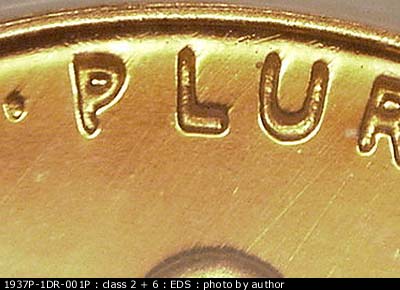 Die-stage A marker on 1937P•1DR•001P showing A few small die scratches show above the Lu of Pluribus.