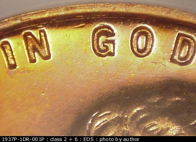 Die-stage A marker on 1937P•1DR•001P showing The die Gouge shows near the rim between the end of IN and the G of God.