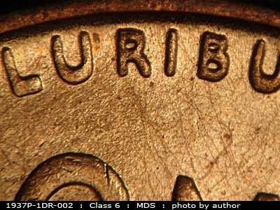 Die-stage B marker on 1937P•1DR•002 (1937 Doubled Die Reverse).