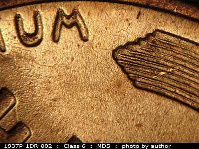 Die-stage B marker on 1937P•1DR•002 (1937 Doubled Die Reverse).
