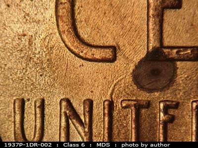 Die-stage B marker on 1937P•1DR•002 (1937 Doubled Die Reverse).