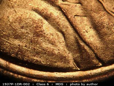Die-stage B marker on 1937P•1DR•002 (1937 Doubled Die Reverse).