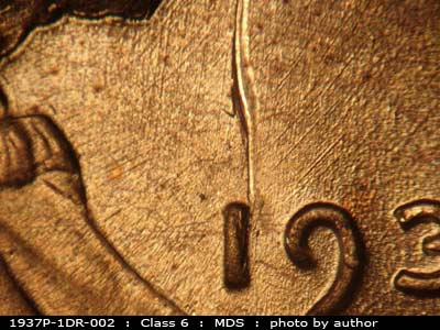 Die-stage B marker on 1937P•1DR•002 (1937 Doubled Die Reverse).