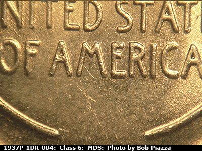 Die-stage B marker on 1937P•1DR•004 (1937 Doubled Die Reverse).