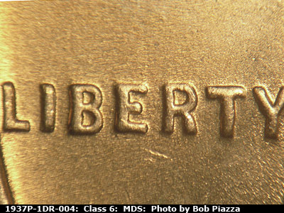 Die-stage B marker on 1937P•1DR•004 (1937 Doubled Die Reverse).