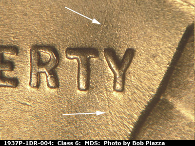 Die-stage B marker on 1937P•1DR•004 (1937 Doubled Die Reverse).