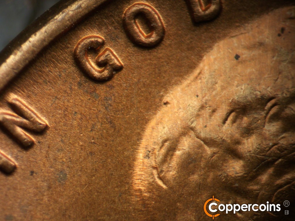 Die-stage B marker on 1937S•1DO•002 showing A small but heavy die gouge shows on the back of the head under GOD. Extra thickness on IN GOD.