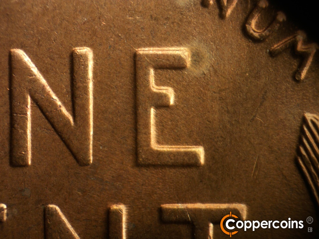 Die-stage B marker on 1937S•1DO•002 showing Die crack on upper E in ONE.
