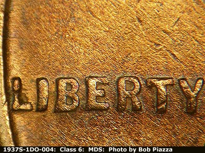 Die-stage B marker on 1937S•1DO•004 (1937 Doubled Die Obverse).