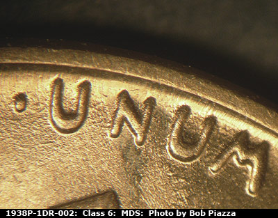 Die-stage B marker on 1938P•1DR•002 (1938 Doubled Die Reverse).
