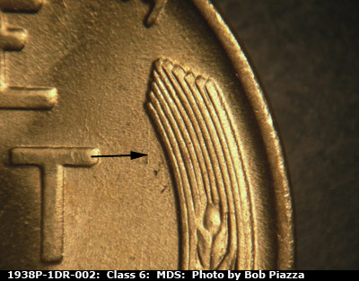 Die-stage B marker on 1938P•1DR•002 (1938 Doubled Die Reverse).